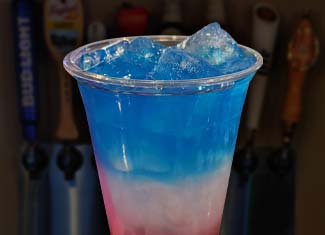 Red white blue drink from happy hour daily specials menu at Pineland Grille in Arkdale WI