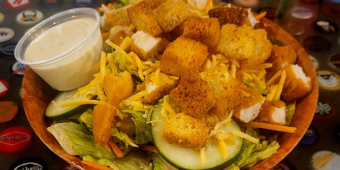 Caesar salad from lunch and dinner menu at Pineland Grille in Arkdale WI